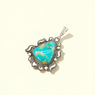 Turquoise pendant on a beige background