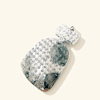 Silver pendant with intricate patterns on a white background