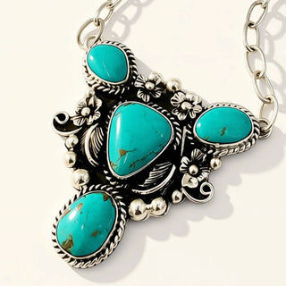 silver jewelry with turquoise stones on a beige background
