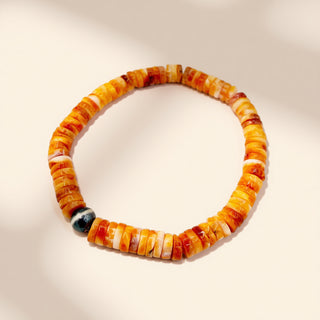 Multicolored beaded bracelet on a beige background