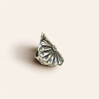 Silver ring on a beige background