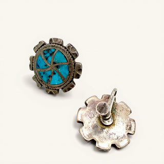 Silver earrings with turquoise stone on a white background