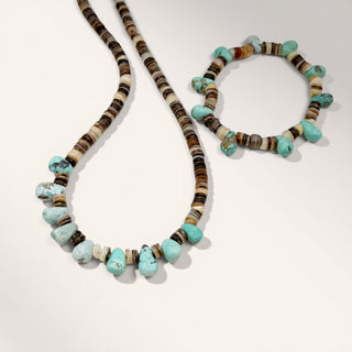 Necklace and bracelet with turquoise and brown beads on a white background