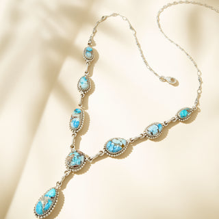 Turquoise stone necklace on a beige background