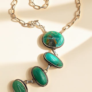 Necklace with turquoise stones on a beige background
