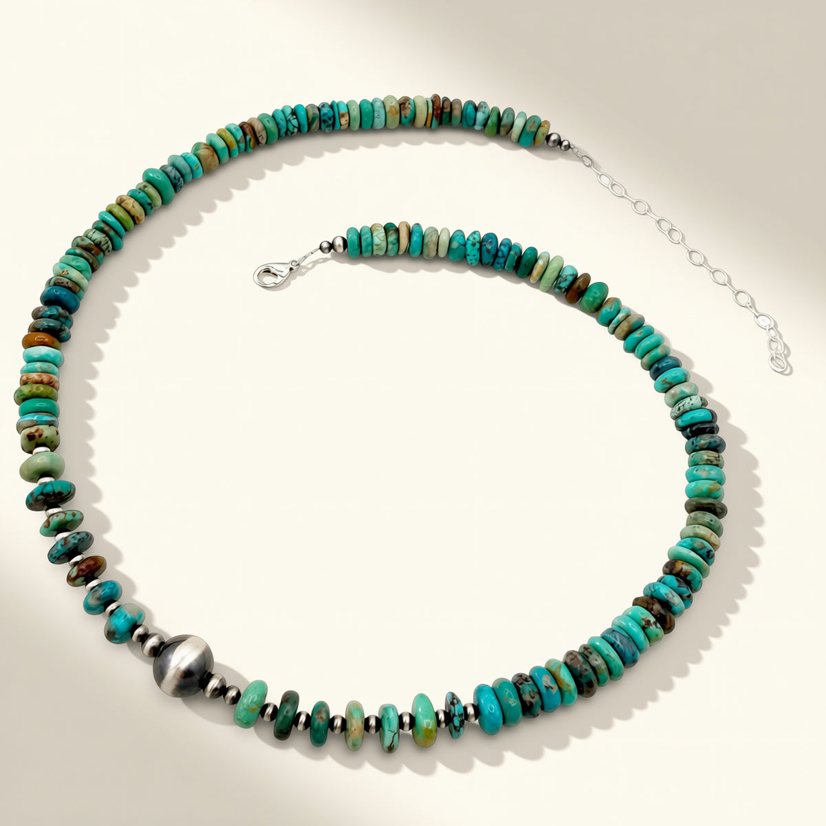 Necklace with turquoise and brown beads on a white background