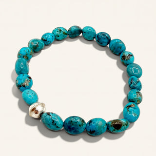 Turquoise beaded bracelet on a white background