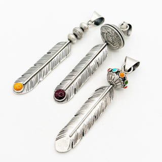 Big Bad Feather Pendants by Jason Ogg