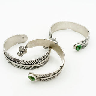 Feather Spinner Cuffs by Jason Ogg