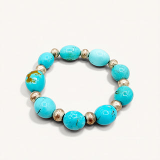 Turquoise beaded bracelet on a white background