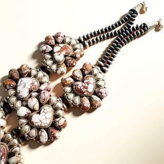 Necklace with decorative stones on a beige background