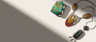 Three turquoise jewerly on a beige background
