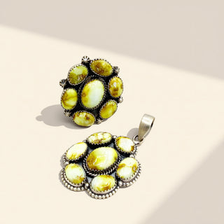 Two yellow stone jewelry on a beige background