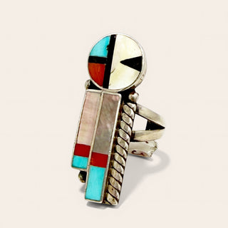 Multicolored inlay ring with geometric design on a white background