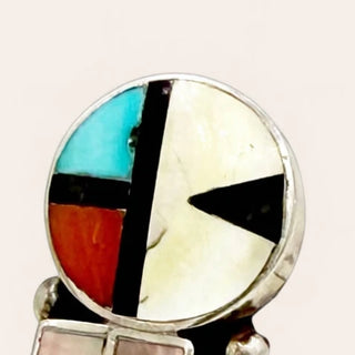Multicolored inlay ring with geometric design on a white background