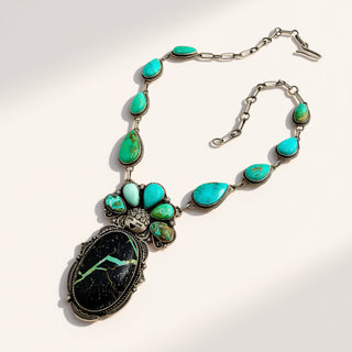 Turquoise necklace with silver clasp on a white background