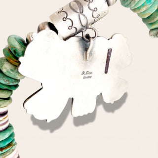 green beaded jewelry with silver pendant with 'R. Tom Sterling' engraved 