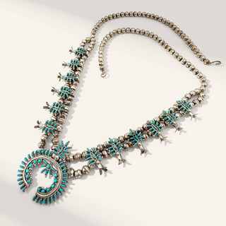 Necklace with turquoise stones on a white background