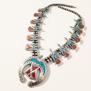 Silver necklace with colorful beads on a white background